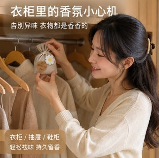 Sachet bag hanging in wardrobe between white shirts - lifestyle shot showing elegant placement