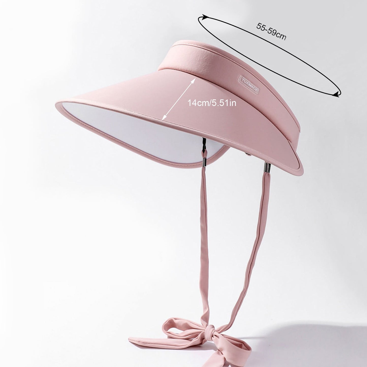 Woman wearing wide brim sun hat for UV protection outdoors