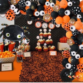 Halloween balloon arch close-up - spider foil balloon, eye balloons, orange confetti balloons, black balloons