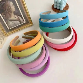 Second full color stack shot - all 12 candy colors displayed together, lifestyle flat lay