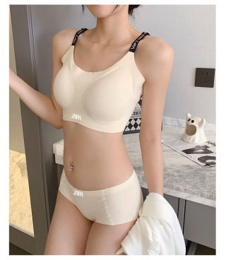 Sage green bra and underwear set on hanger with matching underwear on desk