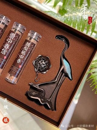 Lotus pendant burner hanging from crane beak - silver lotus incense holder with chain, close-up