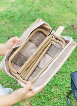 Woman with backpack in forest - folding stool pouch in side pocket, pencil case size for daily carry