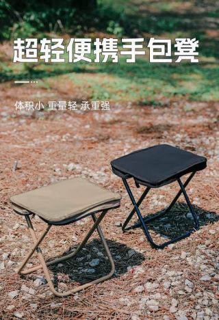 Man sitting on folding stool in forest reading - camping lifestyle, stable on uneven ground