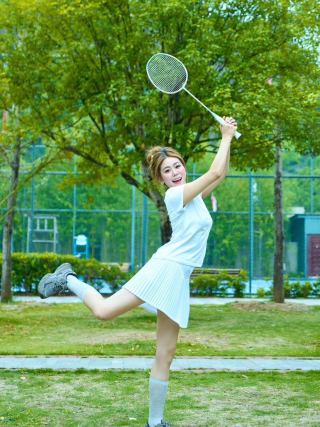 Shuttlecocks on badminton court surface - professional setting showing flight-ready position