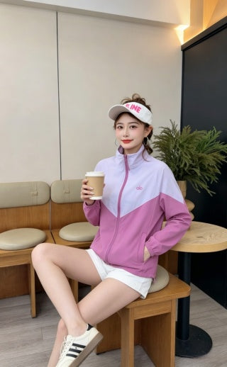 Pink jacket - model standing full length showing relaxed athletic fit