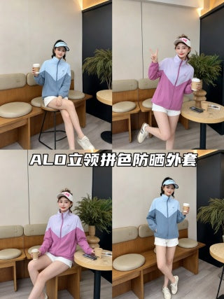 Blue color-block stand collar jacket - model standing in cafe holding coffee