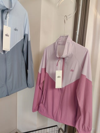 Pink color-block jacket - three models wearing matching jackets with white shorts