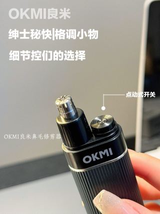 Woman holding two OKMI trimmers - detachable head, rinse under water, clean and hygienic