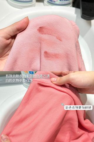 Two bottles on white surface with magazine - lifestyle shot showing premium laundry care positioning