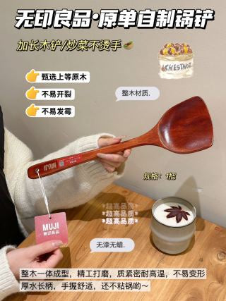 Two spatulas held up showing heat-resistant long handle and natural wood grain texture