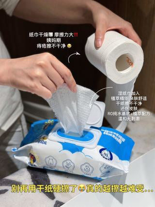 Wowo Dajianji pack next to toilet roll - showing wet wipe as upgrade from dry paper, lifestyle shot