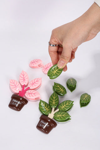 Pink potted plant set on fridge - 4 pink leaf clips stored on pot base, strong magnet holds firm