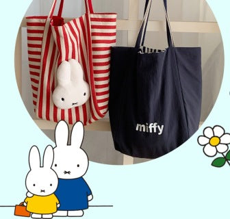Model carrying red stripe Miffy tote on shoulder - street style, casual outfit, bag in use