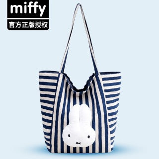 Red stripe Miffy tote and navy Miffy tote hanging side by side with Miffy character illustration