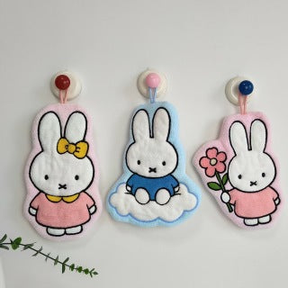 Back of Pink Flower Miffy towel showing hanging loop and coral fleece texture