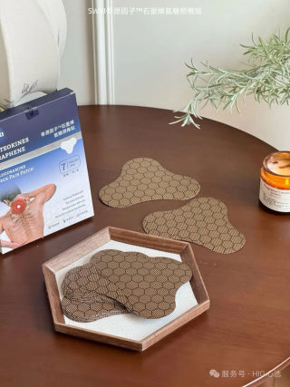 Two patches held in hands showing ergonomic cervical contour shape and flexible material