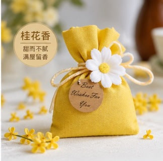 Osmanthus scented sachet bag - yellow osmanthus flowers background with golden linen pouch