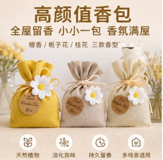 Sachet bag in car - woman smelling osmanthus sachet in car interior, freshening air